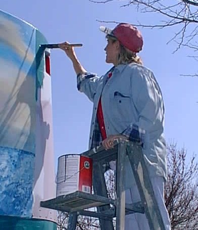 Patty painting a bus on March 28 1999