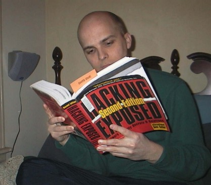 Brett learning computer skills from a library book