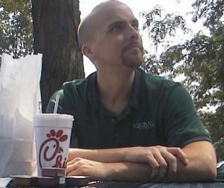 self-portrait at a picnic table