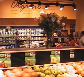 Danielle is in the background of this produce section pic