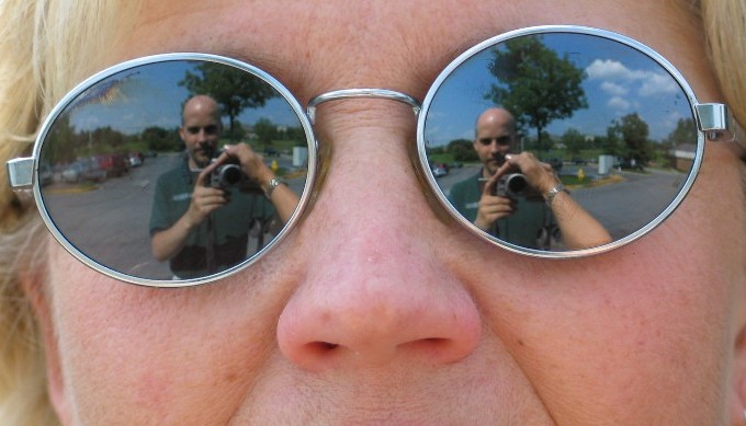 I am reflected in her sunglasses